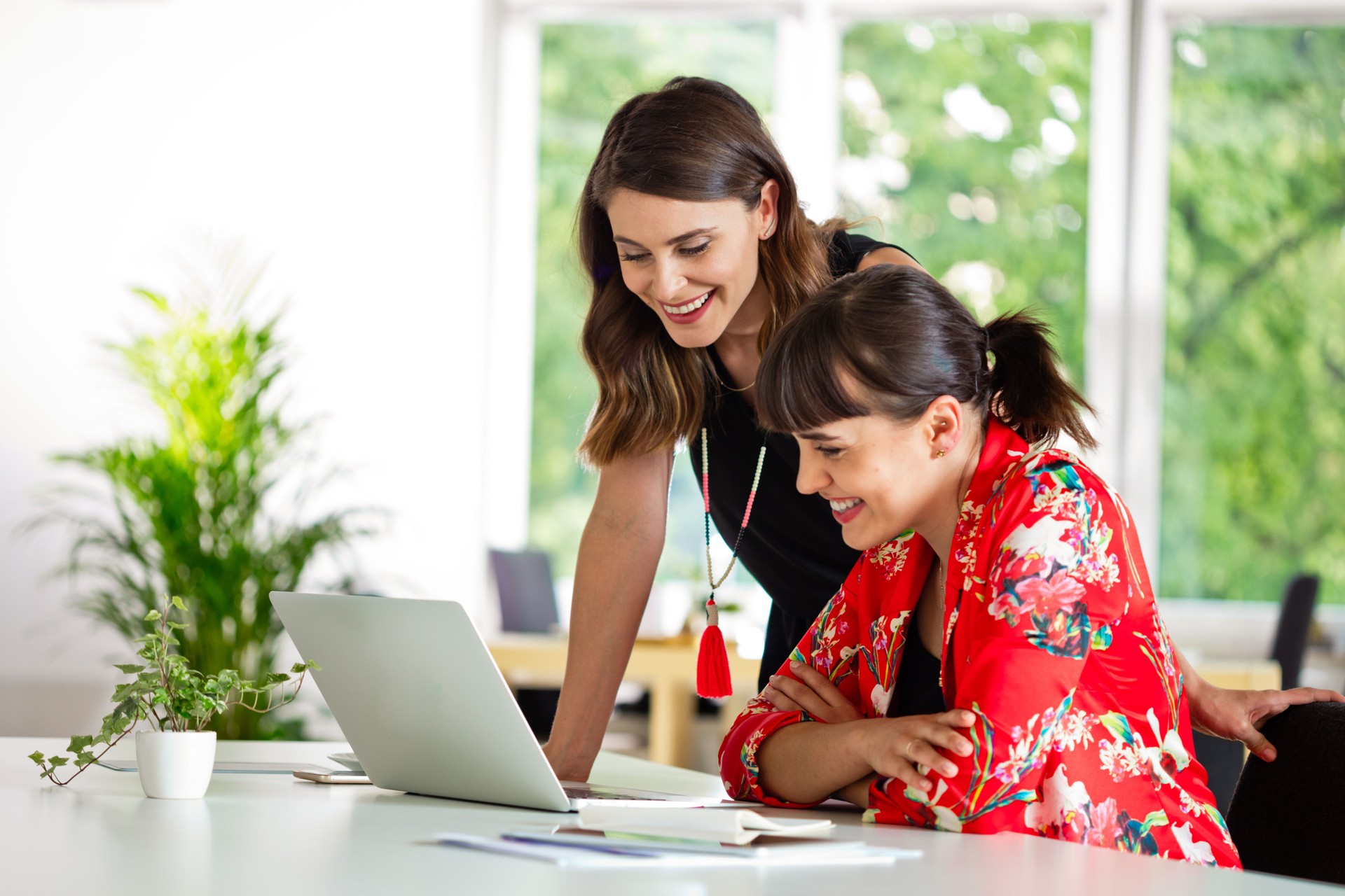 Female shareholders discussing in the creative office
